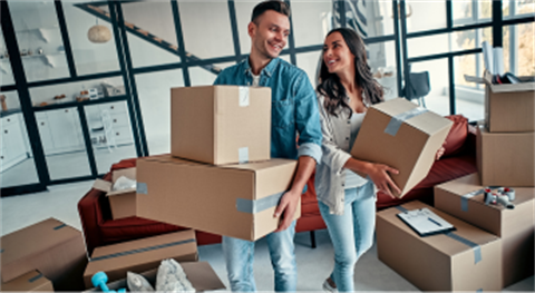 Two people moving into a new home