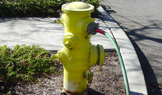 Garden hose connected to hydrant
